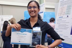 A photo of Vindhya Kota with her Intern of the Year Award.