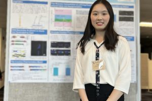 PhD student Yanqi Jiang in front of her poster