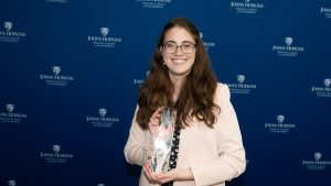 Selena Shirkin (WSE '24, '25) holding trophy at HopStart awards ceremony.