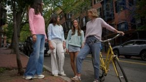 Lauren Choi, creator of The New Norm, and models wearing her sustainable sweater designs.