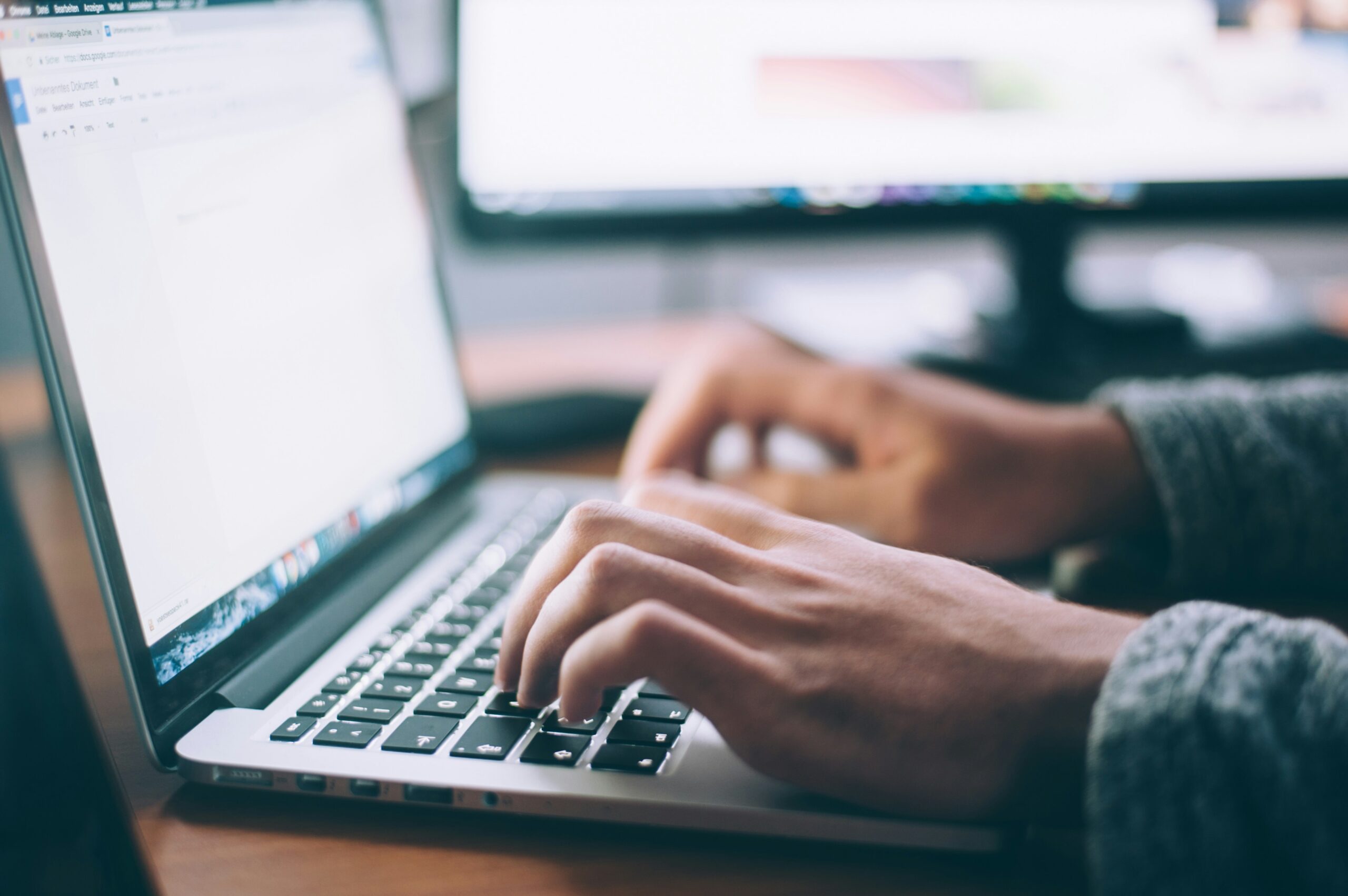 Assessments Person typing on computer