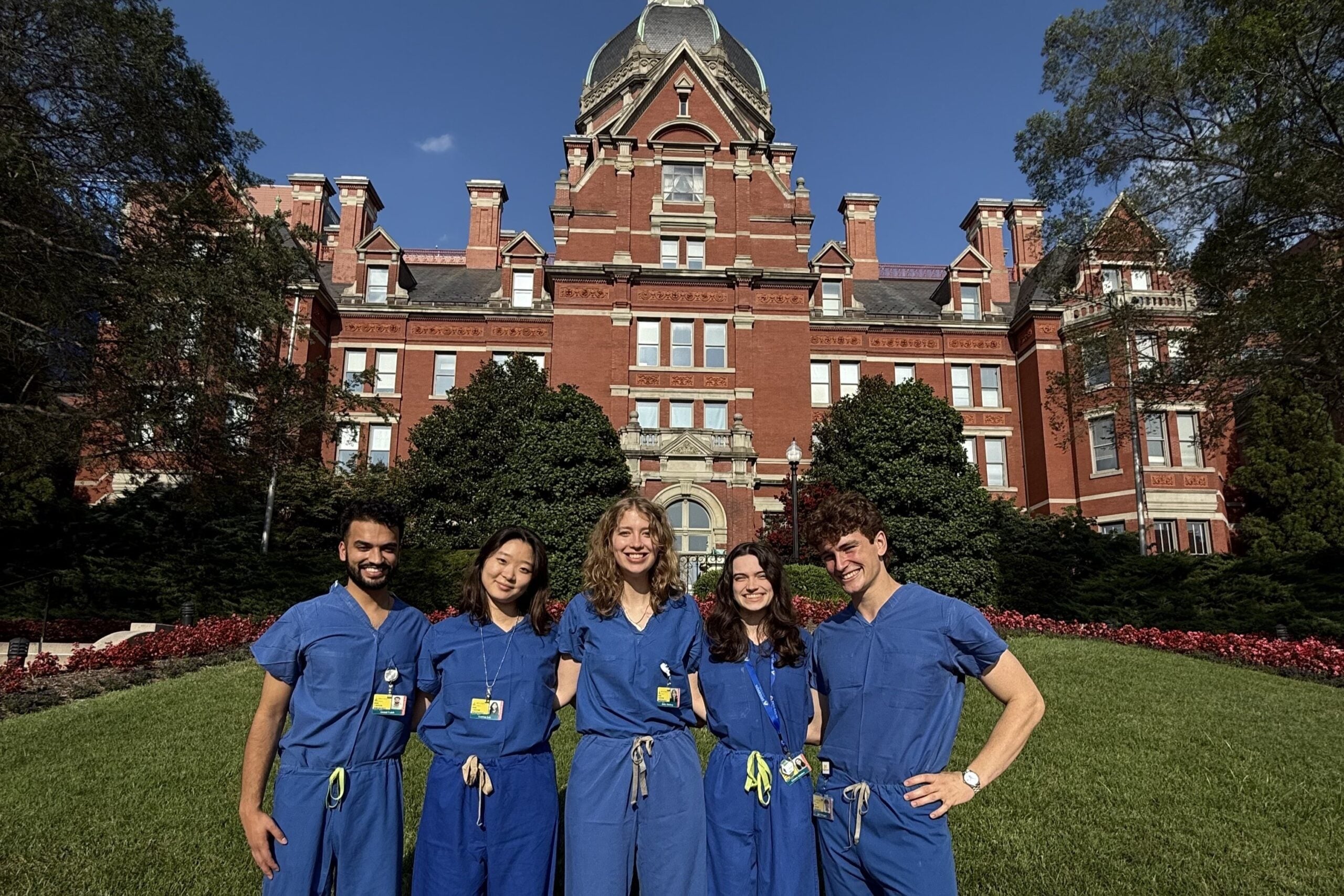 A photo of the Lumenate Medical team in front of the Johns Hopkins Hospital after a summer of shadowing in the Urology department.