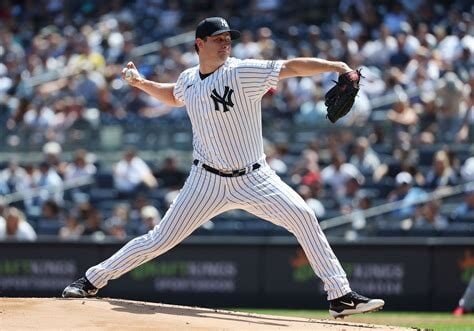 A Yankees pitcher throwing a pitch.