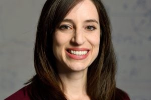 A headshot of Susanna Thon wearing a marron blazer