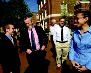 Dean Nick Jones (center) speaks with undergraduate students and faculty about a student design proposal to create a green roof for Ames Hall
