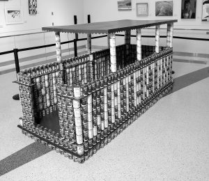 Cans structured to look like a Baltimore Water Taxi