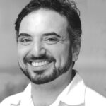 black-and-white photograph of Gregory Falco's torso