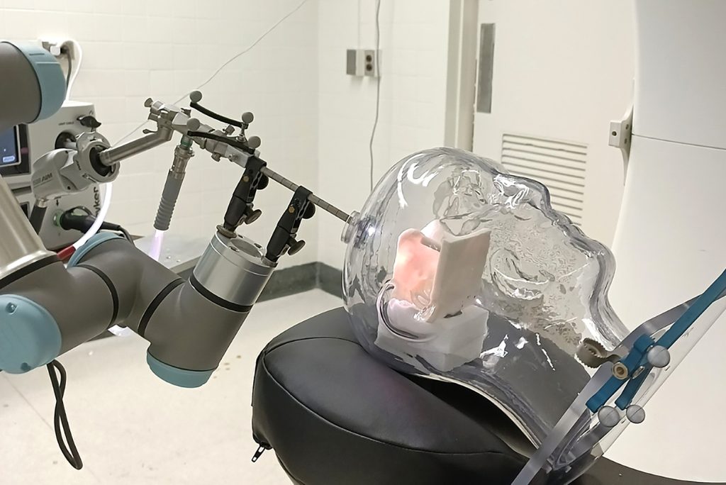 A photo of a model showing a procedure on a glass head.