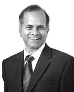 grayscale head shot of Rama Chellappa wearing a suit and tie