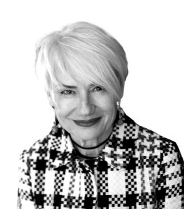 grayscale image of NATALIA TRAYANOVA wearing a plaid jacket