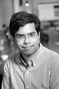 Black and White headshot image of Ishan Barman.