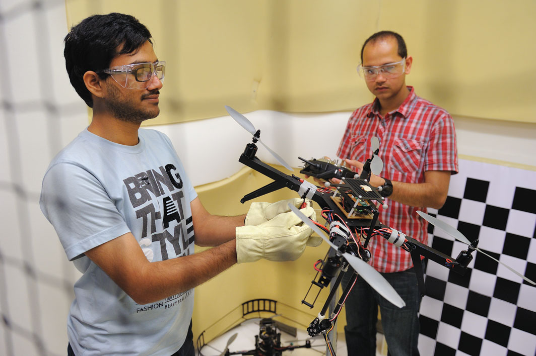 Robo Copter: Graduate students Gowtham Garimella (left) and Subhransu Mishra (right) conduct research in the Laboratory for Computational Sensing and Robotics.