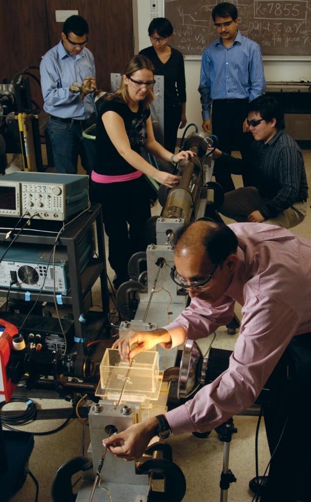 Ramesh mounts a 4-by-2.5 millimeter metallic cylinder, which remains stationary until impact. Once the trigger is activated, a projectile flies out of the gun’s chamber, travels through the barrel, and hits a metal bar. This bar then flies forward and impacts a second, stationary bar, smashing the small cylinder in between.