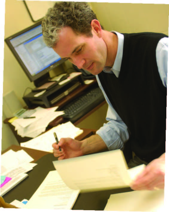 It all comes down to this: Undergraduate Admissions Director John Latting signs letters of acceptance, the culmination of many months—and many rounds—of reviews.