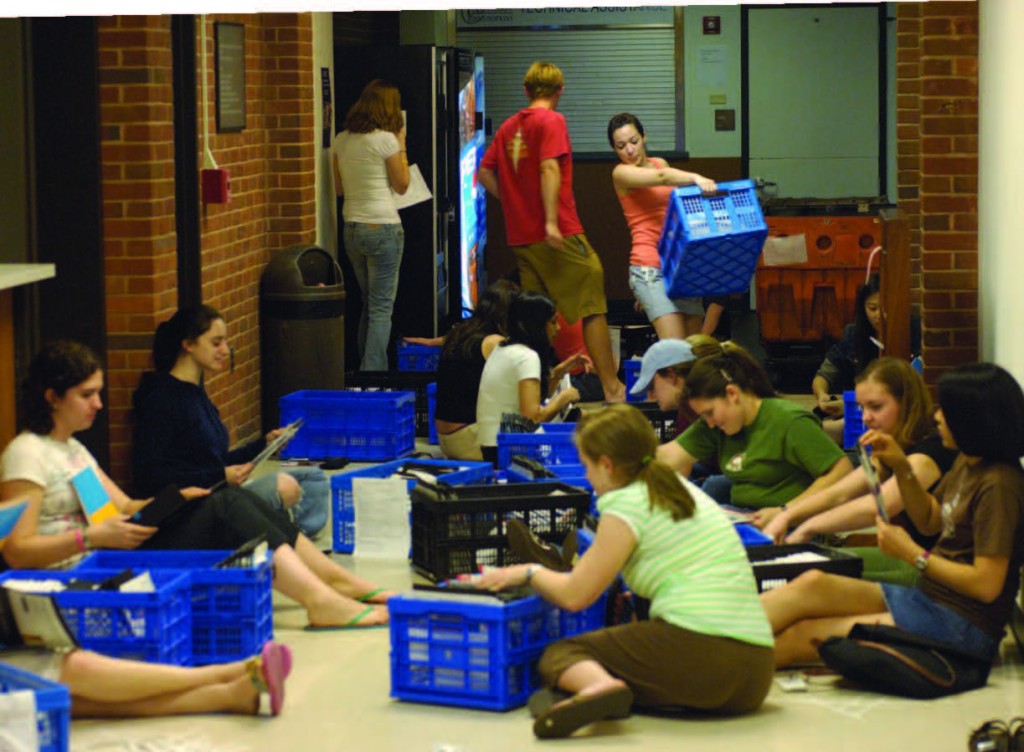 With the big mail drop just 12 hours away, student volunteers help stuff, seal, and apply postage to letters going to this year’s 14,842 applicants.