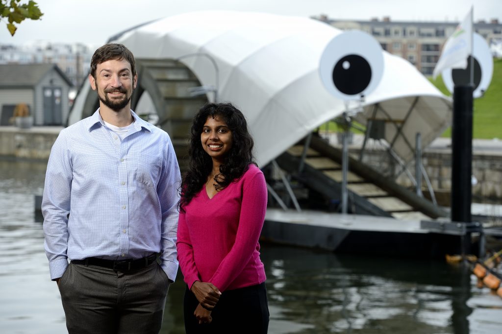 Chris Kelley and Ramya Ambikapathi stand in front of Mr. Trash Wheel