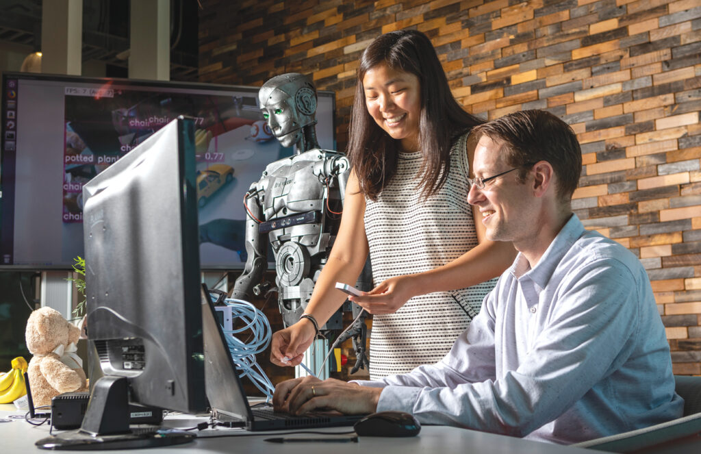 Students work at a computer