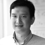 black-and-white photograph of Yinzhi Cao's torso