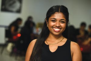 Close-up photograph of Sneha Kamada who is smiling