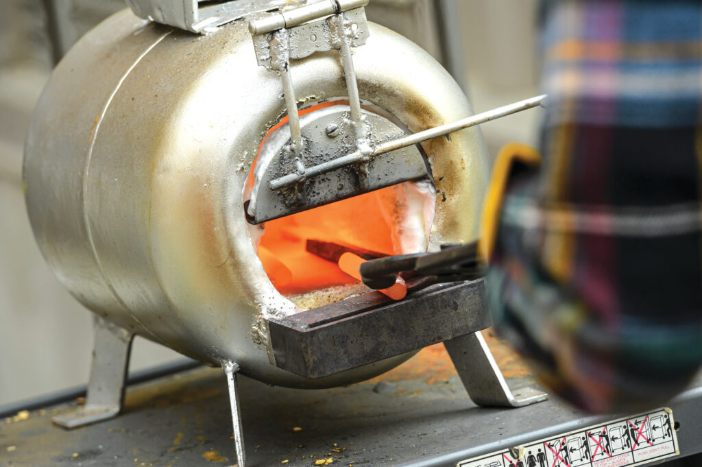 Photograph of heated metal being softened by fire