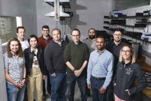 Photograph of the human genome team standing in a lab