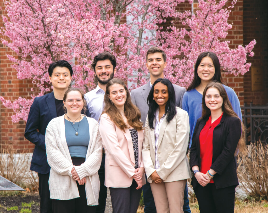 A group photo of the eight-person student research team.