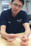 Photograph of Stipe Iveljic holding the small Spine Align device