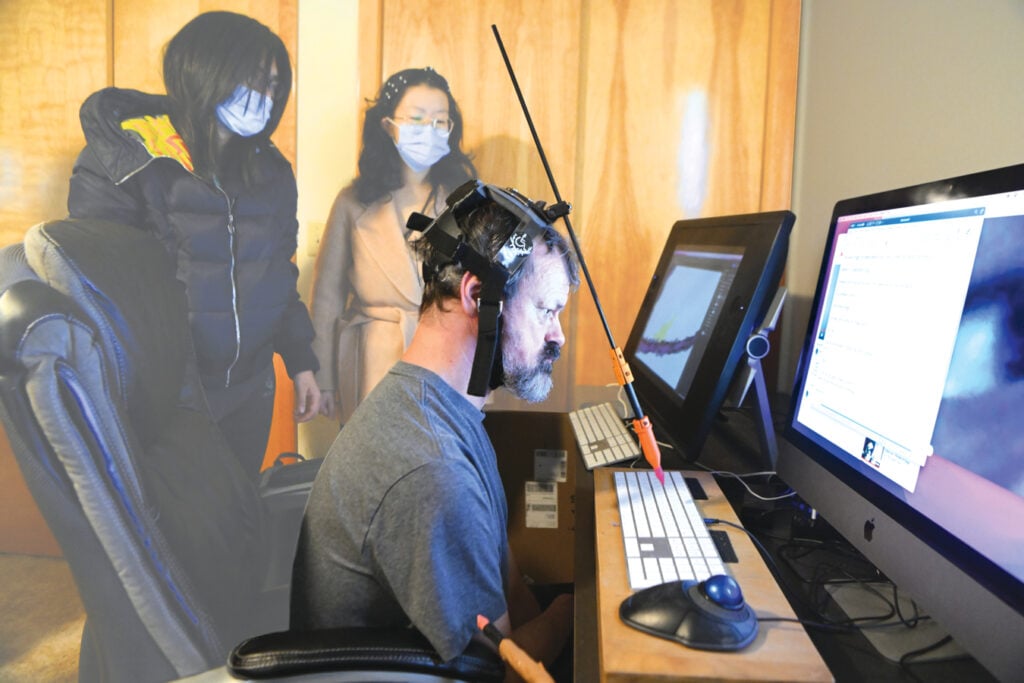Dan Keplinger using the stylus to interact with a computer.