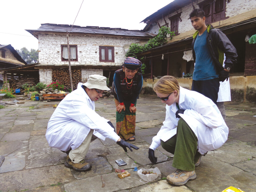 Mohan Dangi (left) working with others in Nepal.
