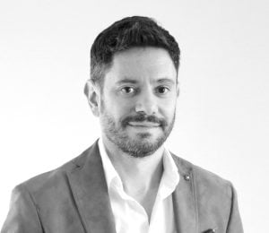 grayscale image of Laureano-Moro-Velazquez wearing a suit jacket