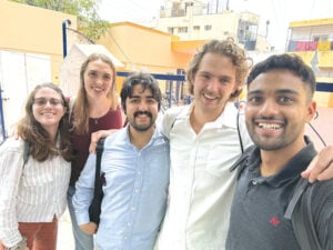image of students standing in a group and smiling