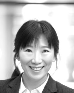 Black and white photo of Yun Chen smiling.