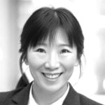 Black and white photo of Yun Chen smiling.