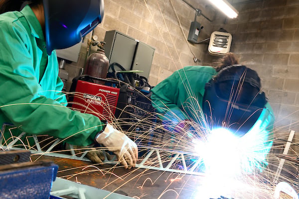 Image of two welders at work