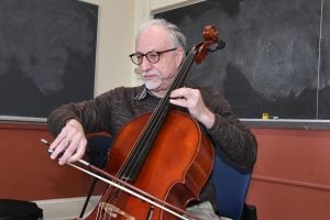man playing a cello