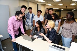 A group of students at a desk