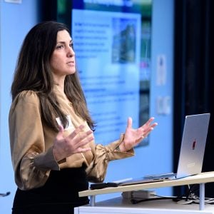woman speaking at podium.