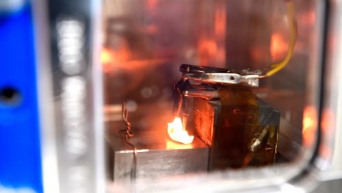 Fire attached to a metal device in a chamber