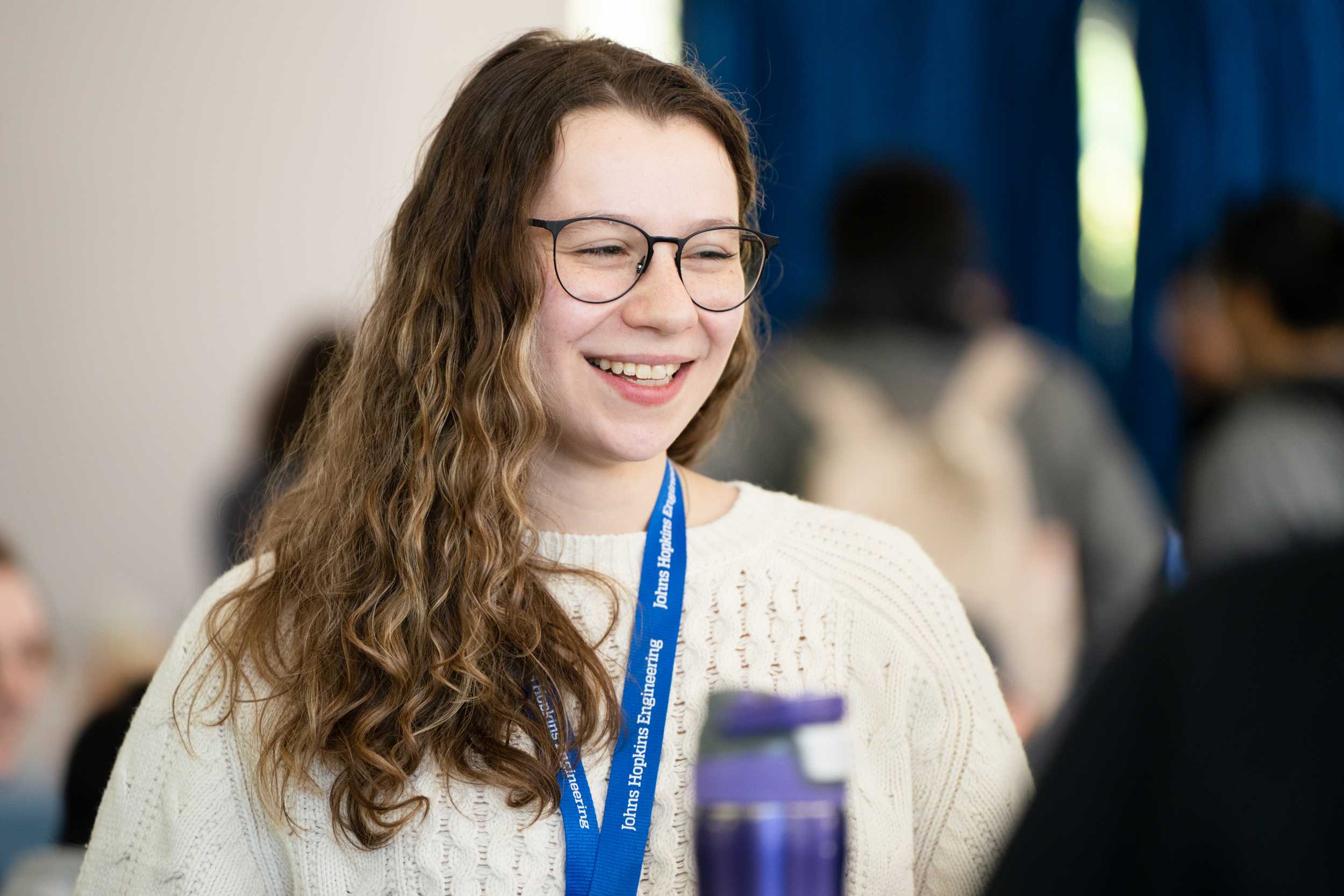 Student smiling at Connect2Campus event.