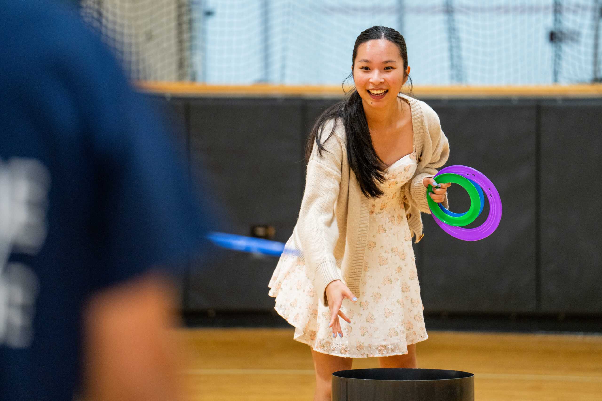 Attendee playing ring toss at 2024 Masters graduate BBQ.