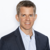 Cris Moen pictured smiling in a professional headshot.
