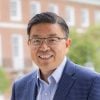 Headshot photograph of Hongang Cui outdoors on campus.