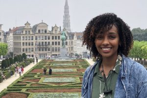 Rayyan Gorashi posing for a picture with mont des arts garden in the background behind her.