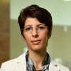 A headshot of Soudeh Ghorbani wearing a white blazer.