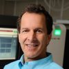 A headshot of Steven Salzberg wearing a blue shirt.