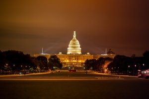 Night view of the Capitol building with lights.