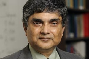 A headshot of Somnath Ghosh wearing a gray blazer.