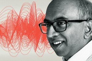 A headshot of Tilak Ratnanather with red waves pattern in the background