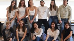 Group of students posing for picture in two rows.