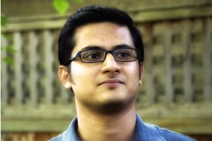 A headshot of Amitabh Basu wearing a blue shirt